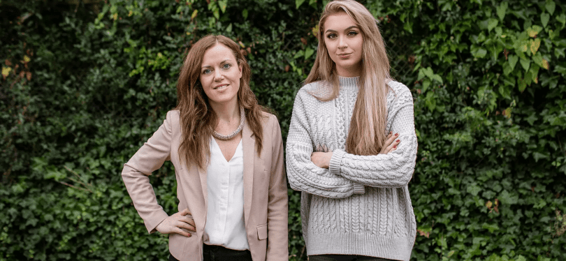 Photograph of two employees