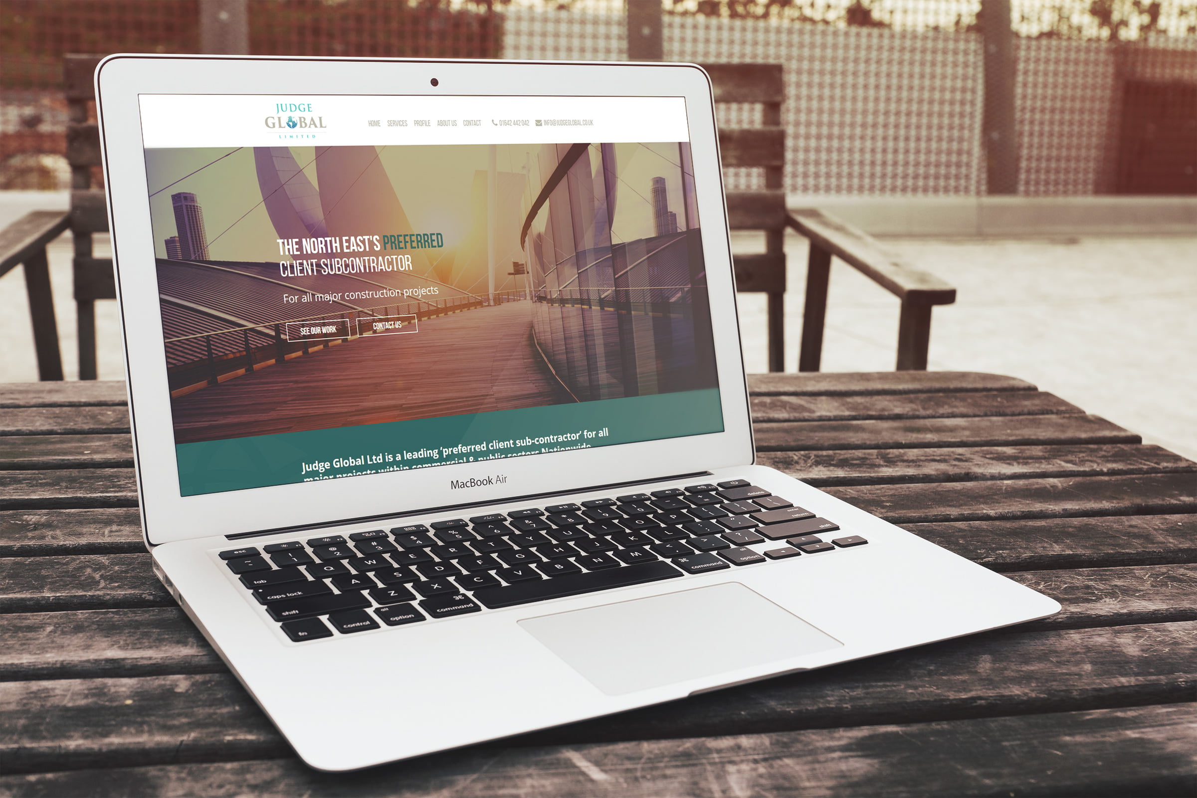 Judge Global website displayed on laptop