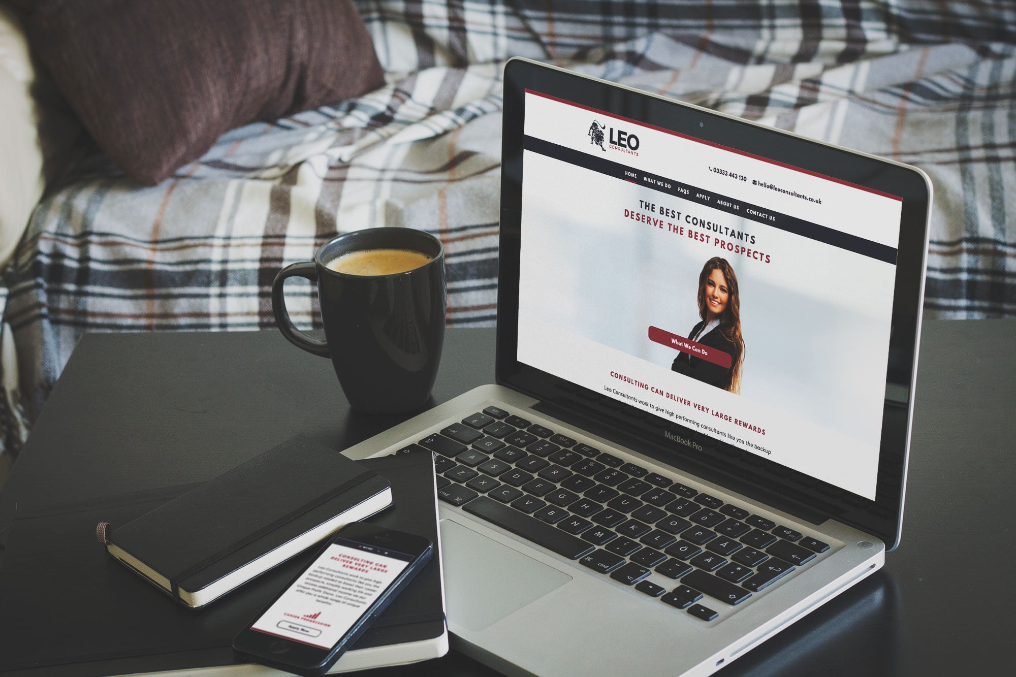 Leo Consultants website displayed on laptop