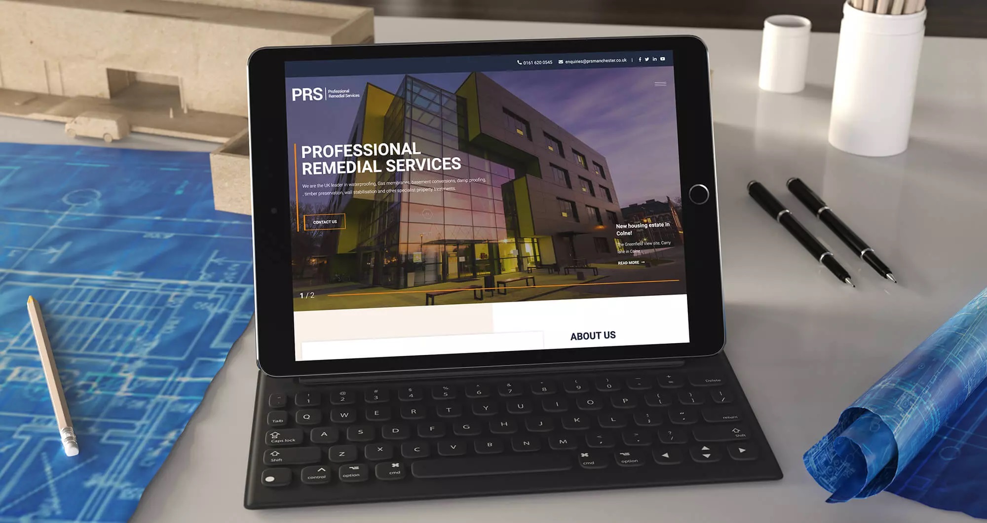 PRS website displayed on a tablet with keyboard