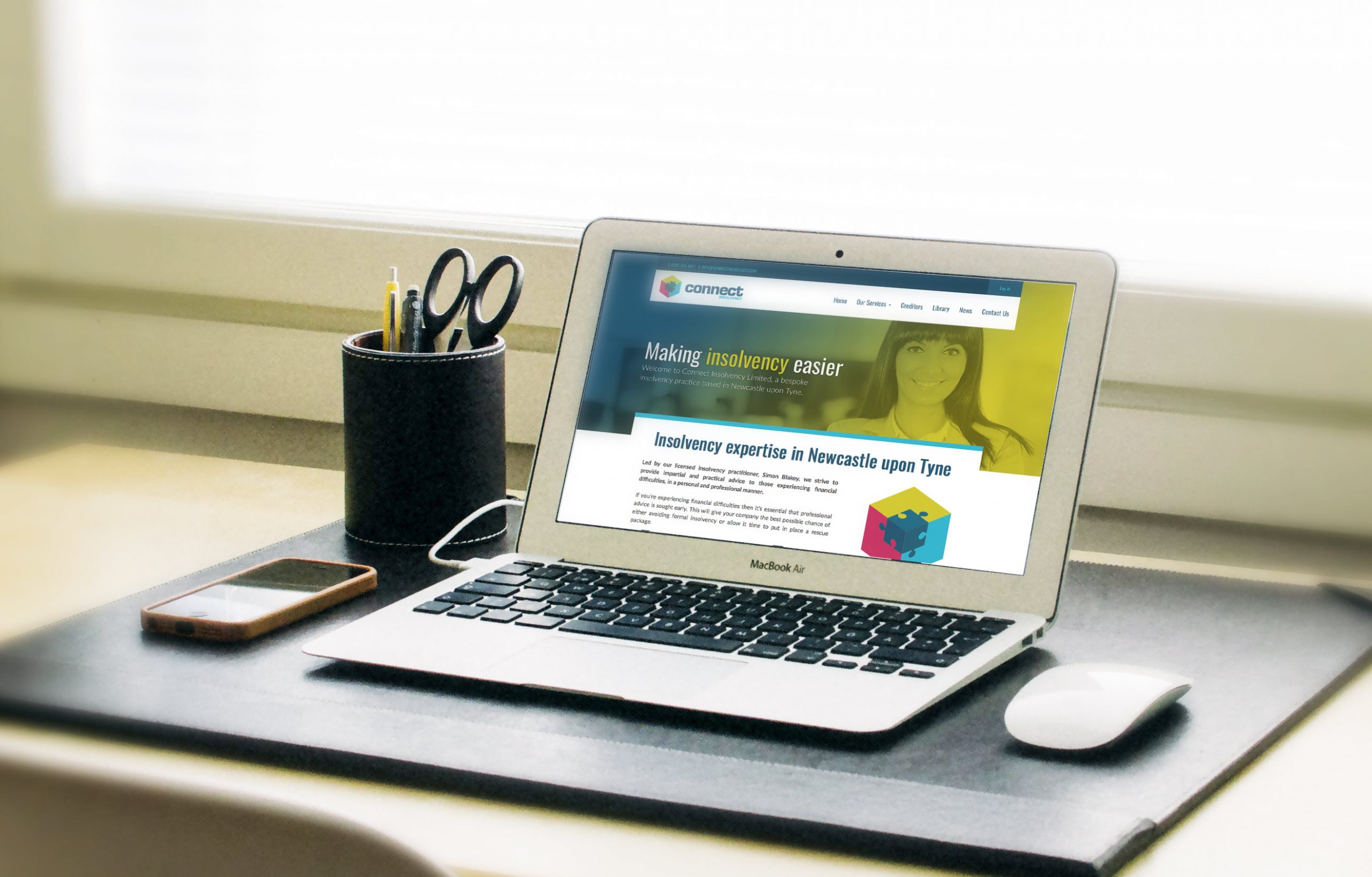 Connect Insolvency website displayed on laptop