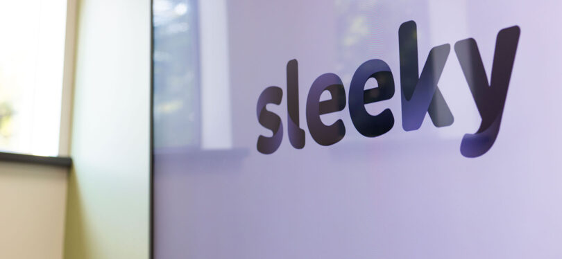 sleeky logo on a large tv screen